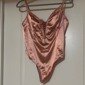 Charlotte Russe  Pink bodysuit Lace-Up L
